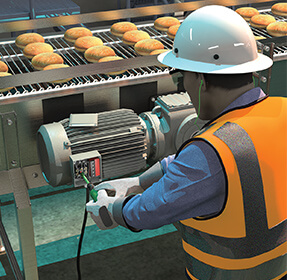 Illustration graphic of a worker assessing a food conveyor issue